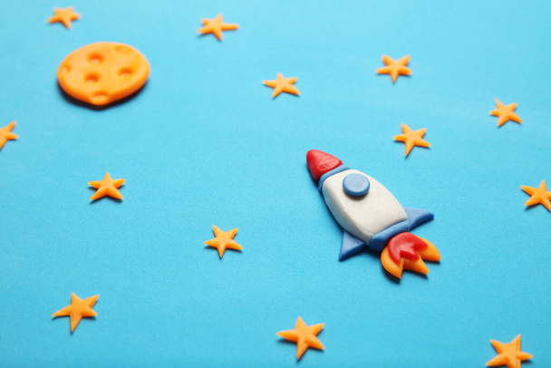 Kid (child) rocket in space, adventure and science. Stars, and moon. Plasticine art, cartoon. - Photo, image