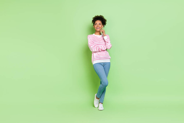 Photo of dreamy lady look empty space imagine romantic date wear striped shirt isolated green color background. - Photo, image