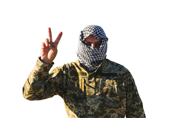 Soldier in the camouflage uniform and checkered keffiyeh shemagh bandana. No war concept and peaceful sign. Isolated on white background. - 写真・画像