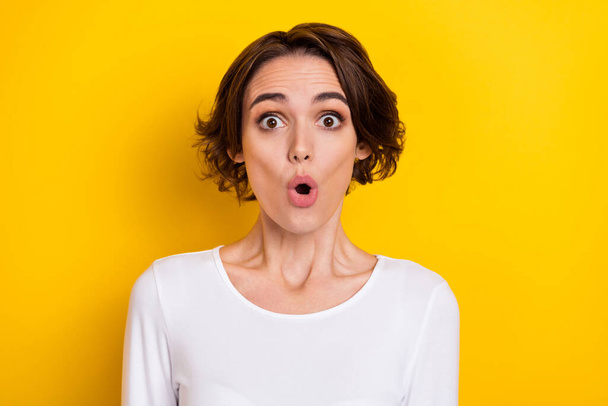 Photo of young pretty woman astonished bad information open mouth isolated over yellow color background. - Фото, зображення