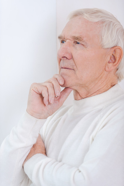 Senior man holding hand on chin - Photo, Image