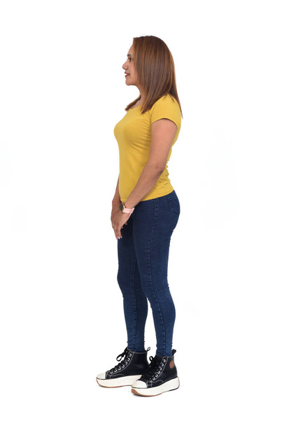 side view of woman with slim jeans on white background - Foto, Imagem