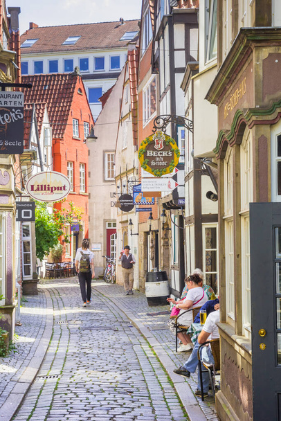 Narrow cobblestoned street in the Schnoor quarter of Bremen, Germany - Photo, Image