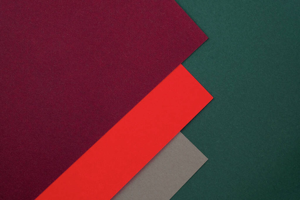 Sheets of red, green and gray paper, palette of colored paper. Abstract paper colorful background. soft pastel colored empty space for text. geometrical texture with colored carton.  - Foto, immagini
