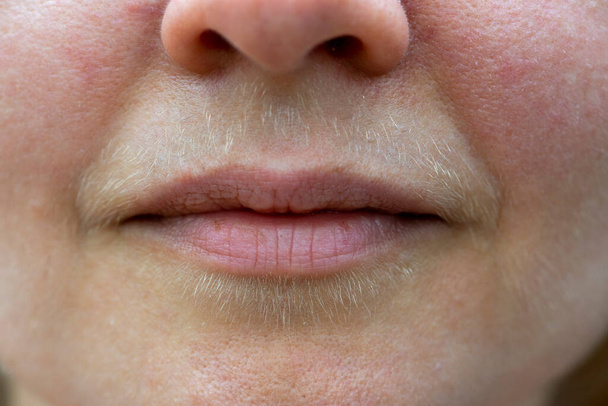 Natural hairy upper lip of a body positive young woman. Close up. - Fotó, kép