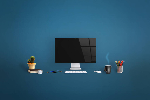 Computer display surrounded by office supplies on blue background. Clean screen for web page promotion - Photo, Image