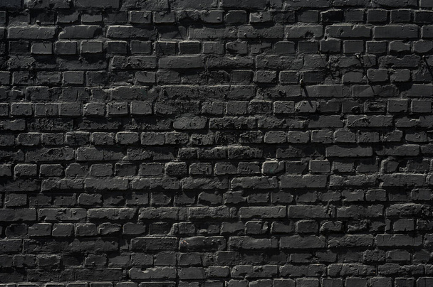 Old black brick wall texture ,brick wall texture for interior design vintage dark tone. - Фото, зображення