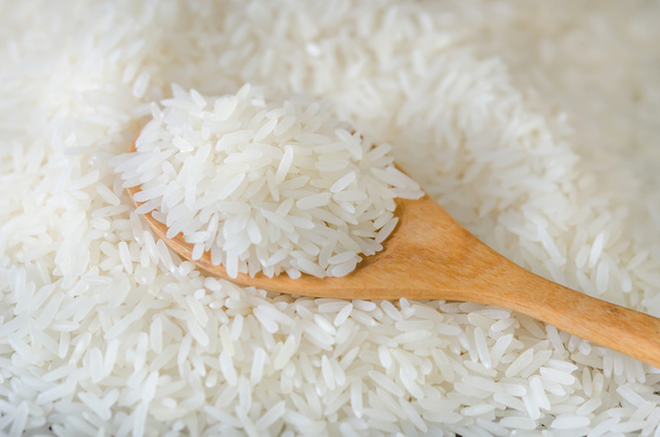 Wooden spoon with rice  - Photo, Image