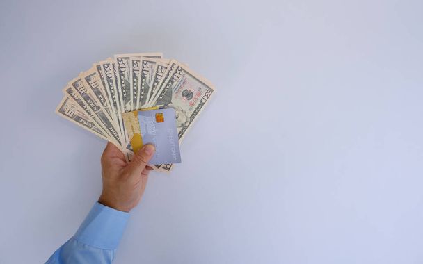 female hands holding paper money on white background. - Zdjęcie, obraz