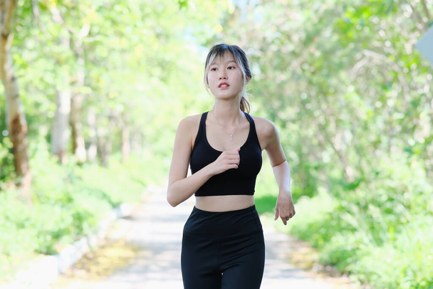 young Asian beautiful woman at workout outdoors  - 写真・画像