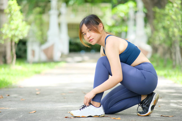 Young Asian woman at workout outdoors in the park  - Zdjęcie, obraz
