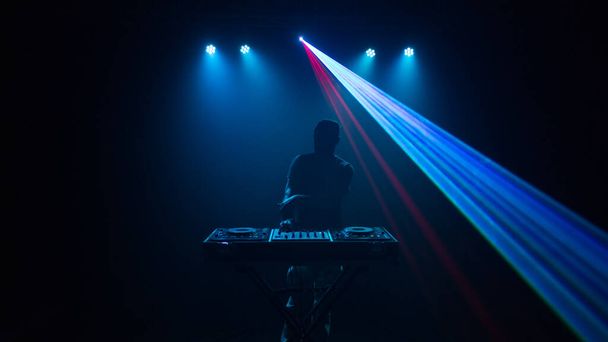 Disc jockey, DJ with laser light. Front view - Valokuva, kuva