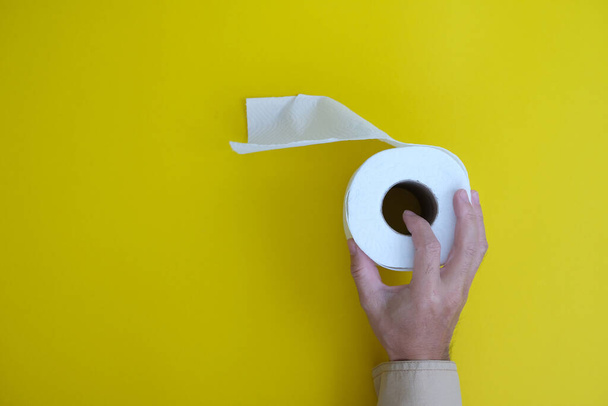 toilet paper roll over yellow background  - Foto, Imagen