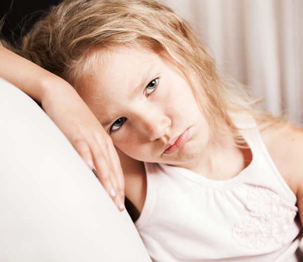 Sad little girl at home - Фото, изображение