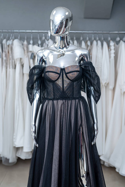 Elegant black evening dresses on the mannequin in showroom. Fashion concept - Foto, afbeelding