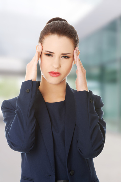 Woman suffering a headache - Foto, Imagen