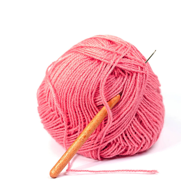 Red crochet yarn against white background - Photo, Image