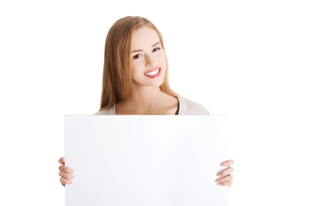 Woman holding an empty banner - Photo, image