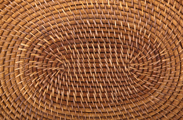 Closeup of Traditional Woven Grass Mat in Circular Pattern - Fotoğraf, Görsel