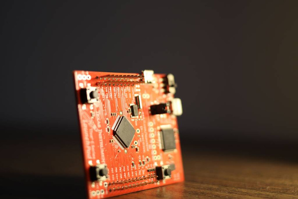 a surface mounted semiconductor chip on a microcontroller PCB. - Photo, image