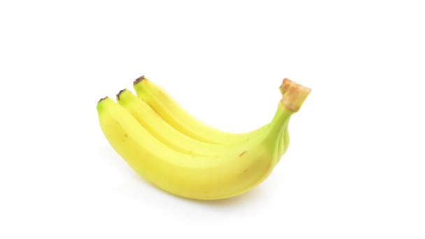 Banany na białym tle - Materiał filmowy, wideo