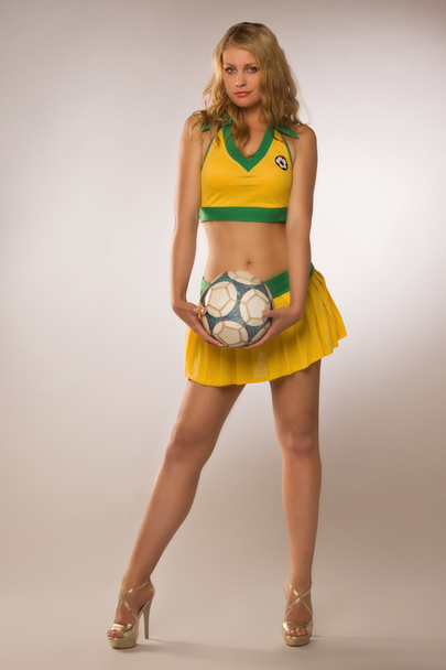beautiful sexy blond cheerleader whit soccer ball - Foto, Imagem
