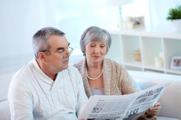 Senior couple reading newspaper - Photo, Image