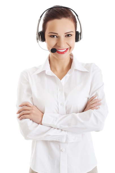 Smiling call center woman with folded arms - Foto, immagini