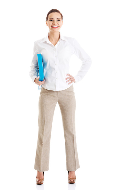 Full length businesswoman holding binder - Foto, Imagen