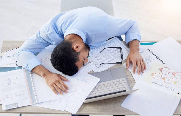 a businessman taking a nap due to being overworked. - Photo, Image