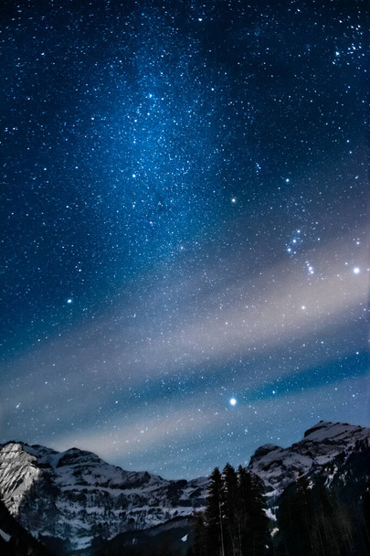 panorama of milky way with the wildstubel massiv in the background. High quality photo. The photo was taken in Lenk which lies in the simmenvalley.  - Foto, Imagen