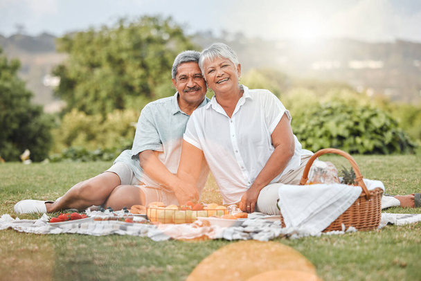 a mature couple enjoying a picnic. - Photo, Image