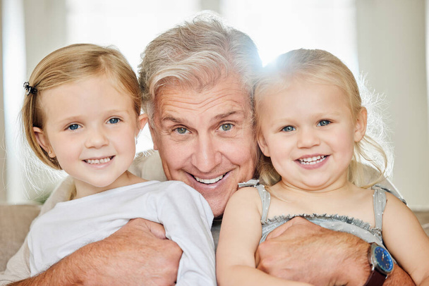 a grandpa and his granddaughters at home. - Photo, image