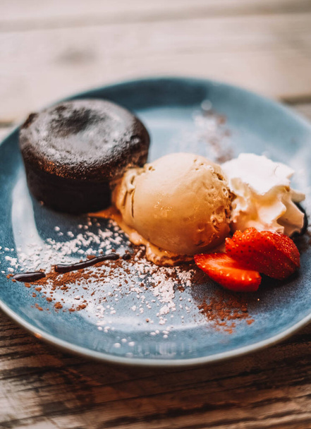 Chocolate coulant dessert with a scoop of ice cream - Photo, Image