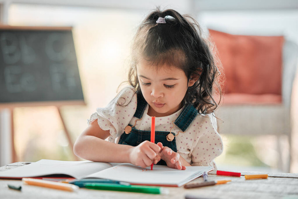 an adorable little girl doing artwork at a table. - Photo, Image
