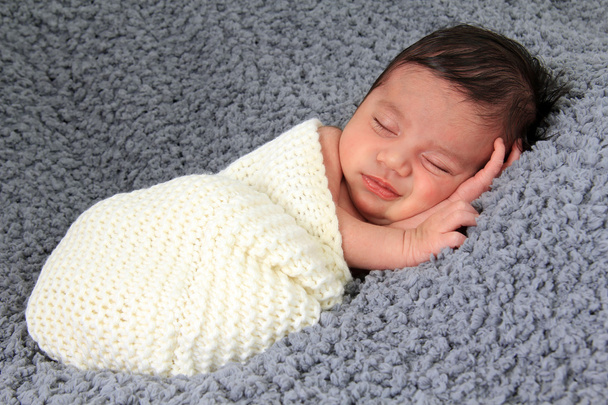 Newborn girl on grey blanket - Photo, Image