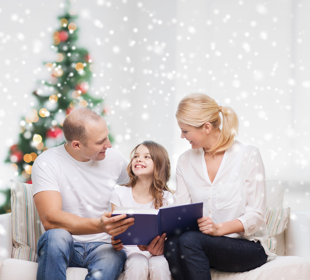 happy family with book at home - Zdjęcie, obraz