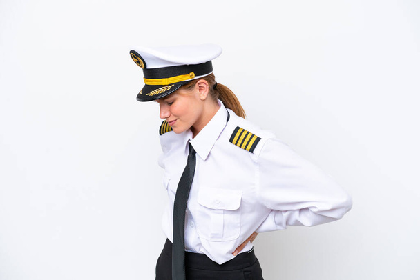 Airplane caucasian pilot woman isolated on white background suffering from backache for having made an effort - Foto, immagini
