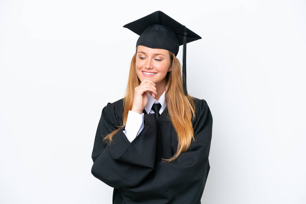 Young university graduate caucasian woman isolated on white background looking to the side - Foto, imagen