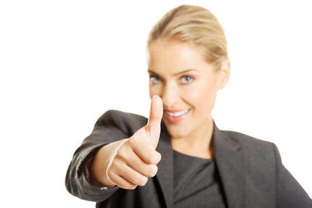 Businesswoman with thumb up gesture - Photo, Image