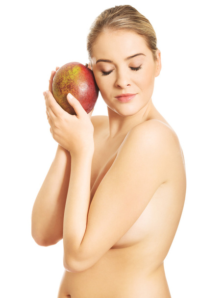 Woman hugging a mango - Foto, imagen