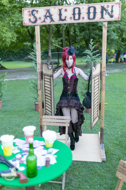 Lucca Comics free cosplay event around city Steampunk Saloon girl play piano. High quality photo - Fotoğraf, Görsel