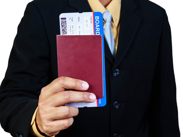 Businessman holding passport and boarding pass concept business  - Fotoğraf, Görsel