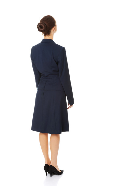 Businesswoman standing back - Фото, изображение