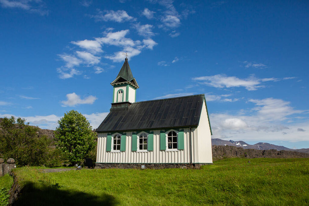 beautiful little Lutheran church in an Icelandic village - Фото, изображение