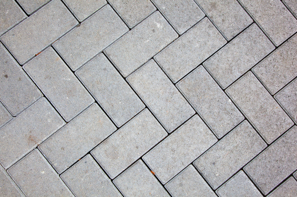 modèle de chaussée faite avec des blocs de béton coulé de couleur grise
 - Photo, image