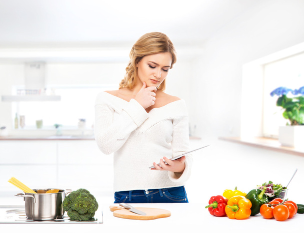 Woman in   modern kitchen - Фото, изображение