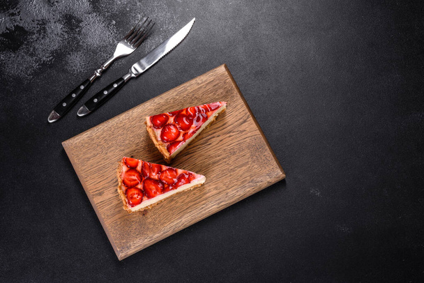 Piece of delicious homemade fresh strawberry pie on a holiday table - Zdjęcie, obraz