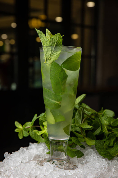 fresh green mojito cocktail with mint and ice  - Fotó, kép