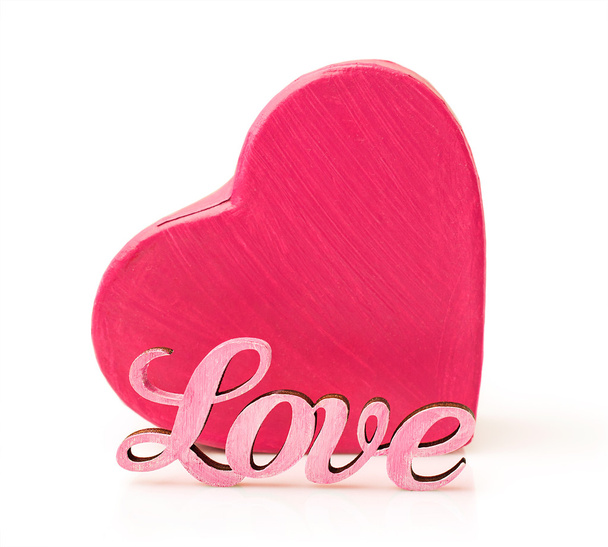 Pink box in heart shape with word love - 写真・画像